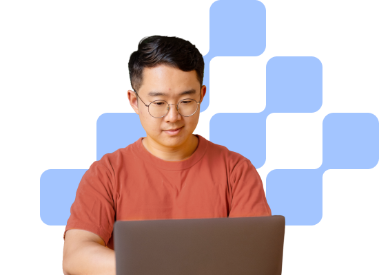man with glasses on his computer